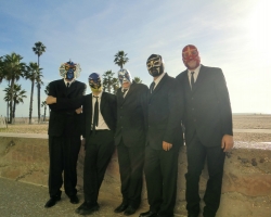 Photo of Los Straitjackets band members standing outside